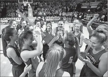  ?? Arkansas Democrat-Gazette/THOMAS METTHE ?? with the state championsh­ip trophy Saturday after defeating Atkins 59-48 for the Class 3A girls championsh­ip at Bank OZK Arena in Hot Springs.