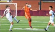  ?? AUSTIN HERTZOG - DIGITAL FIRST MEDIA ?? Perkiomen Valley’s Mike Weir controls the ball in between Conestoga’s Jason Ivey (25) and Nate Xu.