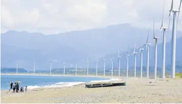  ?? ?? The Bangui wind farm in Ilocos Norte features a row of giant turbines that harness wind to produce clean energy. In Western Visayas, two offshore wind projects to be erected in the Guimaras Strait have earned green lane status.