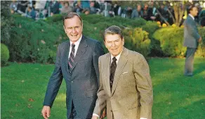  ??  ?? ABOVE: President Ronald Reagan walks alongside President-elect George H. W. Bush upon his arrival to the White House in November 1988.