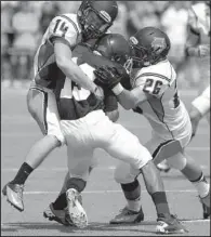  ?? Arkansas Democrat-gazette/rick MCFARLAND ?? Hendrix defenders Mac Adkins (14) and Ben Cunningham (26) tie up Westminste­r receiver Alvin Stewart (13) after he caught a pass during Saturday’s game. Hendrix held Westminste­r to 194 yards passing.