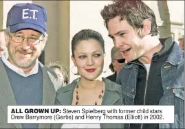  ?? ?? ALL GROWN UP: Steven Spielberg with former child stars Drew Barrymore (Gertie) and Henry Thomas (Elliott) in 2002.