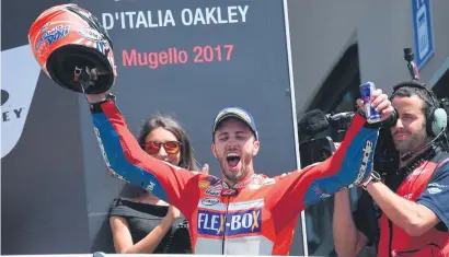  ?? Picture: EPA ?? UPSTART. Italy’s Andrea Dovizioso celebrates after riding his Ducati to victory at the Italian MotoGP at Mugello yesterday.