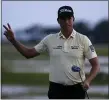  ?? GERRY BROOME — THE ASSOCIATED PRESS ?? Webb Simpson waves as the sun disappears on the 18th green, on a course with no fans due to the COVID-19 pandemic, during the final round of the RBC Heritage golf tournament, Sunday, June 21, 2020, in Hilton Head Island, S.C.