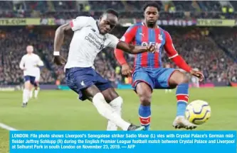  ?? — AFP ?? LONDON: File photo shows Liverpool’s Senegalese striker Sadio Mane (L) vies with Crystal Palace’s German midfielder Jeffrey Schlupp (R) during the English Premier League football match between Crystal Palace and Liverpool at Selhurst Park in south London on November 23, 2019.