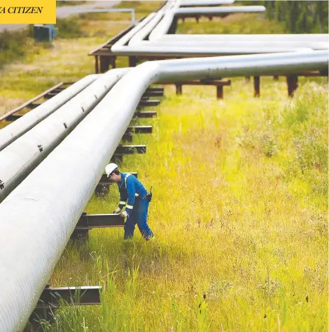  ?? CENOVUS ENERGY ?? A man works amid pipes at Cenovus Energy’s Foster Creek plant northeast of Edmonton. With the halting of Teck’s $20-billion Frontier mine this week, the future of oilpatch projects appears to lie in smaller, “bolt-on” expansion projects from giants like Suncor or Cenovus.