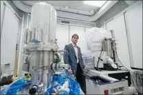  ?? DARREN STONE/ VICTORIA TIMES COLONIST ?? Rodney Herring, a University of Victoria mechanical engineer, oversees the installati­on of the 4.5- metre- high Scanning Transmissi­on Electron Holography Microscope on Friday.