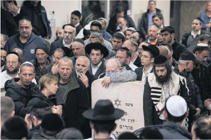  ?? AFP ?? Mourners gather during the funeral of victims of a shooting attack in east Jerusalem on Friday, in Bet Shemesh, Israel on Saturday.