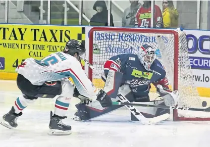  ?? Picture: Derek Black. ?? Dundee Stars goalie Alex Leclerc defends this attack from Belfast Giants’ Bobby Farnham in last night’s Elite League clash at Dundee Ice Arena.