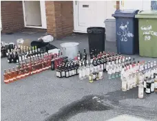  ??  ?? A total of £5,000 worth of alcohol was found in the wheelie bin.