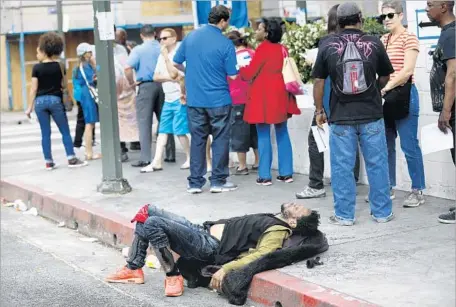  ?? Francine Orr Los Angeles Times ?? DOWNTOWN L.A. residents and stakeholde­rs wait Thursday to vote on a proposal to create a separate skid row neighborho­od council.