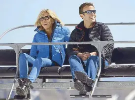  ??  ?? O -duty style: Wearing a quilted pu y jacket with skinny jeans and biker boots during a more casual moment with hubby, French President Emmanuel Macron