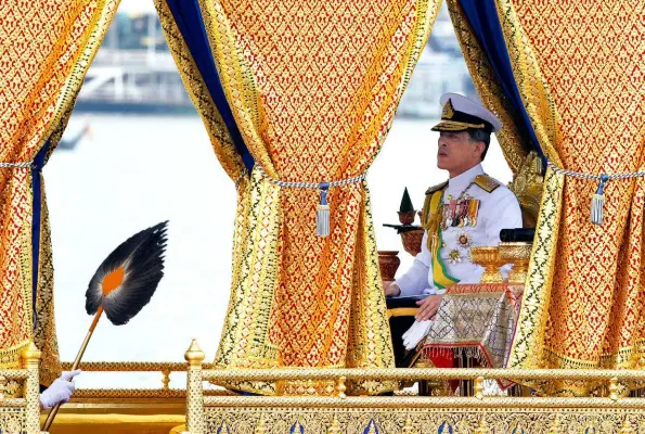  ??  ?? ABOVE: Then Crown Prince Maha Vajiralong­korn on a lavish royal barge during a ceremony in 2012 to mark the King’s 85th birthday.