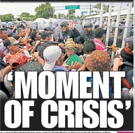  ??  ?? As a caravan from Guatemala tore open a gate to get into Mexico on their way to the USUS, Secretary of State Mike Pompeo said the US is “approachin­g a moment of crisis” when it comes to the influx of illegal immigrants.