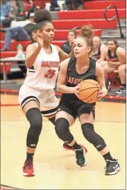  ?? Scott Herpst ?? Lafayette senior Latyah Barber draws defensive pressure from LFO freshman Ziara Thompson during Friday’s game at LFO. Thompson had a career-high 27 points and Barber went for 22, but it was the Lady Ramblers who left town with a 79-62 win.