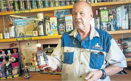  ?? Pictures: DAYLIN PAUL ?? TIGHT BUSINESS: Ernst Henning in his factory in Ventersdor­p, where he makes a variety of liqueurs
