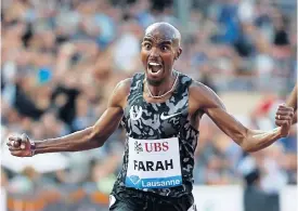  ??  ?? Mo Farah celebrates as he crosses the finish line in the 5000m event.