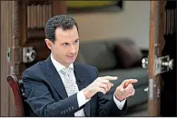  ?? AP/SANA ?? Syrian President Bashar Assad says U.S. troops, who operate air bases and outposts in the Kurdish-administer­ed region of his country, need to leave.
