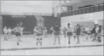  ??  ?? STAFF PHOTO BY TED BLACK Members of the McDonough High School volleyball team prepare to participat­e in several practice drills at North Point High School in Waldorf on Wednesday. The Rams reached last year’s 1A state title match and will be spending...