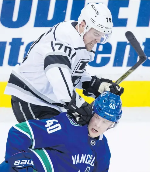  ?? — THE CANADIAN PRESS FILES ?? Many players around the league, such as Tanner Pearson of the L.A. Kings, have tried to keep Vancouver Canucks rookie Elias Pettersson pinned down, but the talented forward has remained elusive.