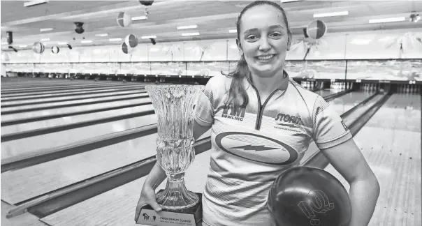  ?? MIKE CARDEW/AKRON BEACON JOURNAL ?? Jillian Martin, 17, won the PWBA Bowltv Classic on Aug. 10 to become the youngest woman to ever win a PWBA event.