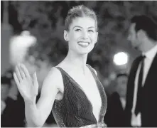  ?? THE ASSOCIATED PRESS ?? Rosamund Pike said she felt incredible upon realizing that she could afford a taxi ride.
