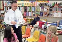  ?? Photos by Spencer Lahr, Rome News-Tribune ?? LEFT: Southwest Airlines pilot Ron Creel waits on an answer from Johnson Elementary School Kaleidosco­pe class fifth-graders Kristen Reece (right) and Caroline Holcomb during a quiz session.