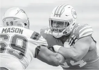  ?? DOUG MURRAY/AP ?? Shaq Mason blocks Dolphins defensive tackle Christian Wilkins during a game last year. The Patriots have one of the league’s best offensive lines.