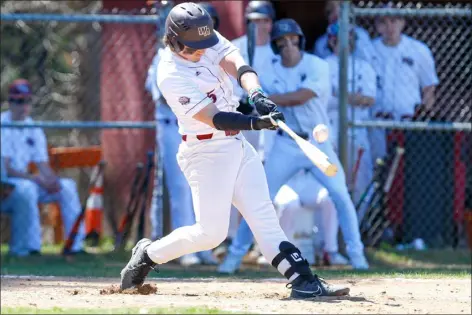  ?? JAMES THOMAS PHOTO ?? Alex Metznk of Westford Academy gets underneath a fastball for a flyout during the fourth inning. Westford nipped Acton-boxboro in baseball action, 2-1.