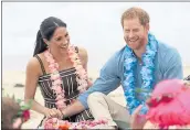  ?? CHRIS JACKSON — POOL/GETTY IMAGES ?? Prince Harry and Meghan Markle meet with members of OneWave, an awareness group for mental health and wellbeing, on Friday at South Bondi Beach in Sydney, Australia.