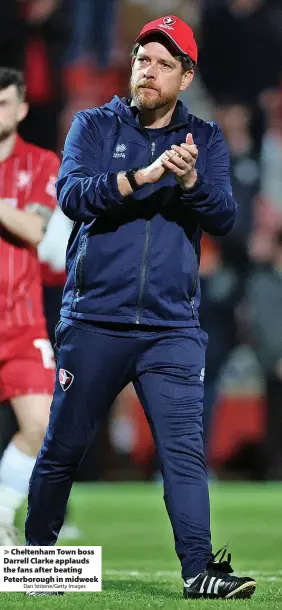  ?? Dan Istitene/Getty Images ?? Cheltenham Town boss Darrell Clarke applauds the fans after beating Peterborou­gh in midweek