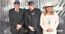  ?? NICHOLAS HUNT/FILMMAGIC ?? Bun E. Carlos, left, Nielsen and Robin Zander at the 31st annual Rock Hall induction in New York in 2016.