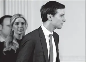  ?? The Associated Press ?? WORLDS COLLIDE: Senior adviser Jared Kushner and his wife Ivanka Trump arrive for a March 17 news conference with President Donald Trump and German Chancellor Angela Merkel in the East Room of the White House in Washington. Kushner and Ivanka Trump can...