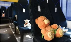 ?? Photograph: Yuriy Dyachyshyn/AFP/Getty Images ?? Stuffed toys symbolisin­g Ukrainian child victims of war sit on seats in an otherwise empty school bus in Lviv.