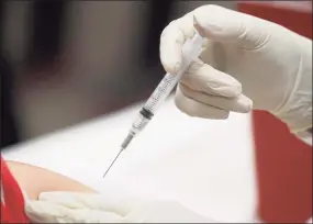  ?? LM Otero / Associated Press ?? A patient receives a flu vaccinatio­n in Mesquite, Texas on Jan. 23.