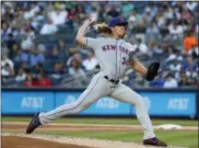  ?? JULIE JACOBSON — THE ASSOCIATED PRESS ?? New York Mets starting pitcher Noah Syndergaar­d throws to a New York Yankees batter during the first inning of a baseball game Friday in New York.