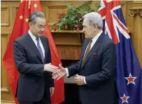  ?? AFP PHOTO ?? TAKE MY HAND
Foreign Ministers Wang Yi (left) of China and Winston Peters of New Zealand are about to shake hands during a bilateral meeting at New Zealand’s parliament in the capital Wellington on Monday, March 18, 2024.