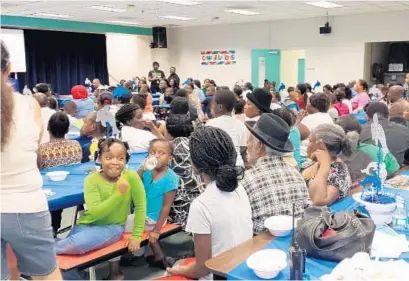  ?? SUBMITTED PHOTO ?? Broward County families learn how to turn meal time into family time through the Hot Food Hot Topics/Fresh Food Fresh Ideas summer series.