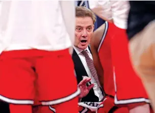  ?? MARY ALTAFFER/THE ASSOCIATED PRESS ?? St. John’s coach Rick Pitino talks to his players Friday during a Big East semifinal against UConn in New York. St. John’s, a 20-win team, didn’t qualify for a seed in the NCAA Tournament.