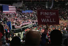  ?? DOUG MILLS / NEW YORK TIMES FILE (2018) ?? Supporters listen to President Donald Trump speak Nov. 5, 2018, at a campaign rally in Fort Wayne, Ind. Trump has employed the term “invaders” in arguing for a border wall.