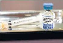  ?? LINDSEY WASSON REUTERS ?? A vial of the measles, mumps, and rubella (MMR) vaccine is pictured at the Internatio­nal Community Health Services clinic in Seattle, Washington, U.S. •