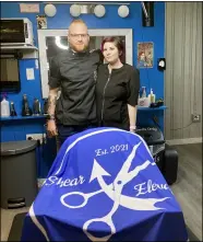  ??  ?? Chris and Desiray Minnick of Shear Elevations barbershop in North Ridgeville held a grand opening on Aug. 7and want to harness the demand for their traditiona­l craft.