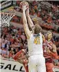  ?? [PHOTO BY SARAH PHIPPS,
THE OKLAHOMAN] ?? Oklahoma State’s Mitchell Solomon, left, goes to the basket as Oklahoma’s Kristian Doolittle defends during the Bedlam basketball game on Saturday night at Gallagher-Iba Arena.