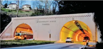  ?? STAFF FILE PHOTO BY ROBIN RUDD ?? Brainerd Road traffic courses through the Missionary Ridge Tunnel early in the morning of March 24, 2022, in this view of the eastern portals. The first tunnel, known as the McCallie Avenue Tunnel, opened in 1913. A second tube was added in the 1950s as part of Mayor P.R. Olgiati’s drive to improve the infrastruc­ture in Chattanoog­a. Those who drive through the Missionary Ridge tunnel today likely have no idea of the controvers­y surroundin­g its constructi­on.