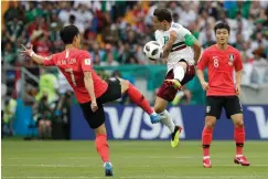  ?? Associated Press ?? ■ South Korea's Son Heung-min, left, and Mexico's Andres Guardado challenge for the ball during the Group F match between Mexico and South Korea at the 2018 World Cup on Saturday in the Rostov Arena in Rostov-on-Don, Russia.