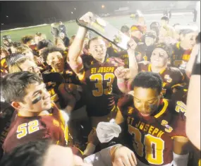  ?? Matthew Brown / Hearst Connecticu­t Media ?? St Joseph celebrates their 17-13 win over Hand in the 2019 CIAC Class L state championsh­ip football game at Veterans Memorial Stadium in New Britian.