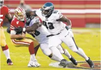  ?? TONYAVELAR/AP ?? San Francisco quarterbac­k Nick Mullens is sacked by Philadelph­ia defensive end Genard Avery and defensive tackle Javon Hargrave during last Sunday’s game.