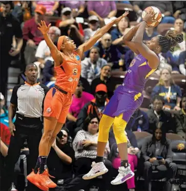  ?? Jessica Hill Associated Press ?? THE SPARKS’ Chelsea Gray shoots over Connecticu­t’s Jasmine Thomas in the first half to help keep the score close before the Sun pulled away to force a potential series-ending Game 3 Sunday at the Pyramid.