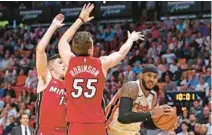  ?? JOHN MCCALL/SOUTH FLORIDA SUN SENTINEL ?? Heat guards Tyler Herro and Duncan Robinson defend against the Trail Blazers in Miami on Jan. 5, 2020.