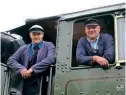  ?? ?? Firemen brothers Nigel (left) and Charlie Barber on No. 45596 at Buxton. RON WILSON